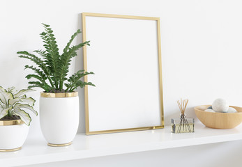 Golden frame leaning on white shelve in interior with plants and decorations mockup 3D rendering