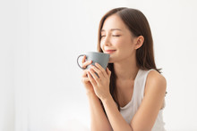 Attractive Girl Is Holding A Grey Mug.