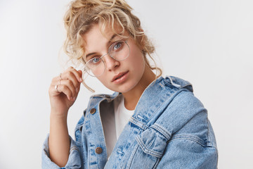 Wall Mural - Smart creative attractive fashionable female magazine editor touch rim glasses tilting head curiously look interested intrigued study project listening coworker suggestion, standing white background