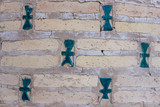 Fototapeta Zwierzęta - Oriental blue, green tiles in a brick wall