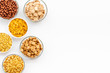 cereals, oatflakes and cornflakes for healthy breakfast on white background top view mock up