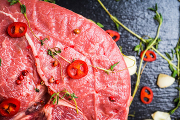 Wall Mural - Raw fresh meat on the rustic background. Selective focus. Shallow depth of field. 