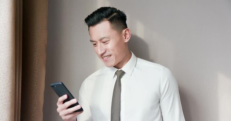 Poster - Asian businessman use cellphone