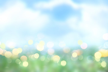 Summer spring nature blurred background.Green grass blue sky texture.Easter backdrop.