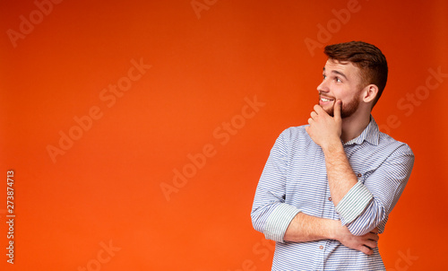 Young Bearded Guy Thinking About Something And Looking Up At Free