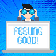 Wall Mural - Writing note showing Feeling Good. Business concept for causing happy positive feelings about life have satisfaction Man Holding and Looking into Binocular Behind Laptop Screen