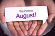 © dolphfyn - Hand showing welcome august.