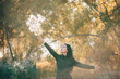© Daniil - Dreamy beautiful girl with thistle flowers bouquet in golden sunlight on bokeh background with yellow leaves. Inspired girl enjoys sunset in autumn forest. Female beauty portrait among autumn foliage.
