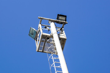 Wall Mural - Spot light pole over clear blue sky background