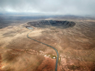 high angle aerial of meteor crater, arizona.