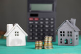 House search Concept , Calculator ,Money and Diffrent Houses