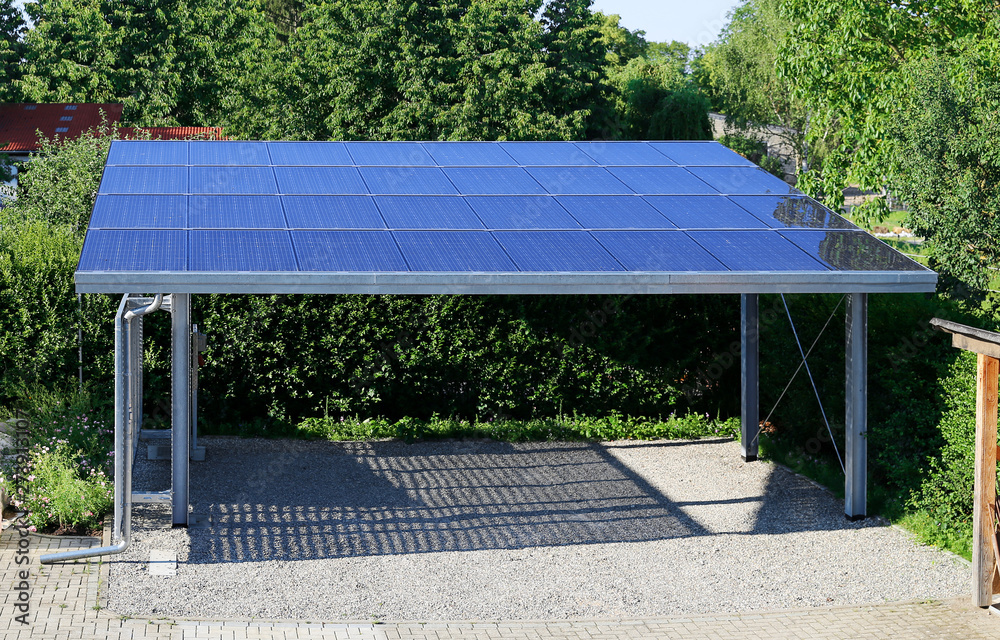 New carport with semi transparent photovoltaik moduls - obrazy, fototapety, plakaty 