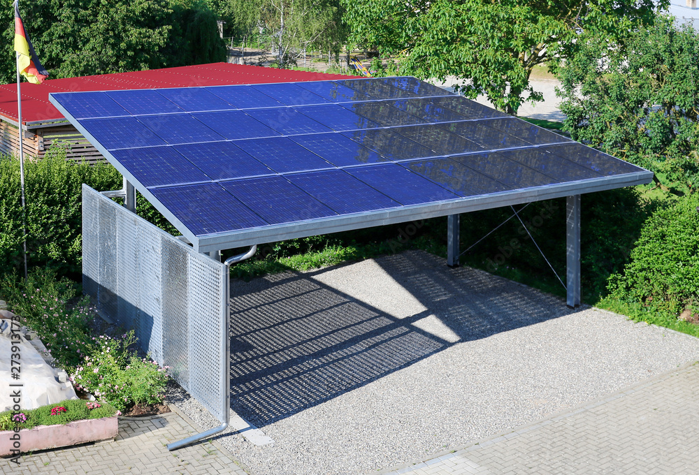 New carport with semi transparent photovoltaik moduls - obrazy, fototapety, plakaty 