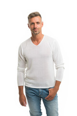 menswear and fashionable clothing. man calm face posing confidently white background. man looks hand