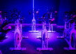© alivealivea - An indoor cycling dance class in a blue LED lighting room