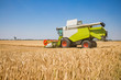 © Westend61 - Austria, Burgenland, combine harvester on a wheat field