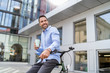 © Westend61 - Businessman with bicycle in the city