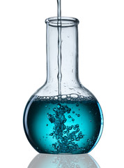 Wall Mural - different laboratory glassware with liquid and with reflection