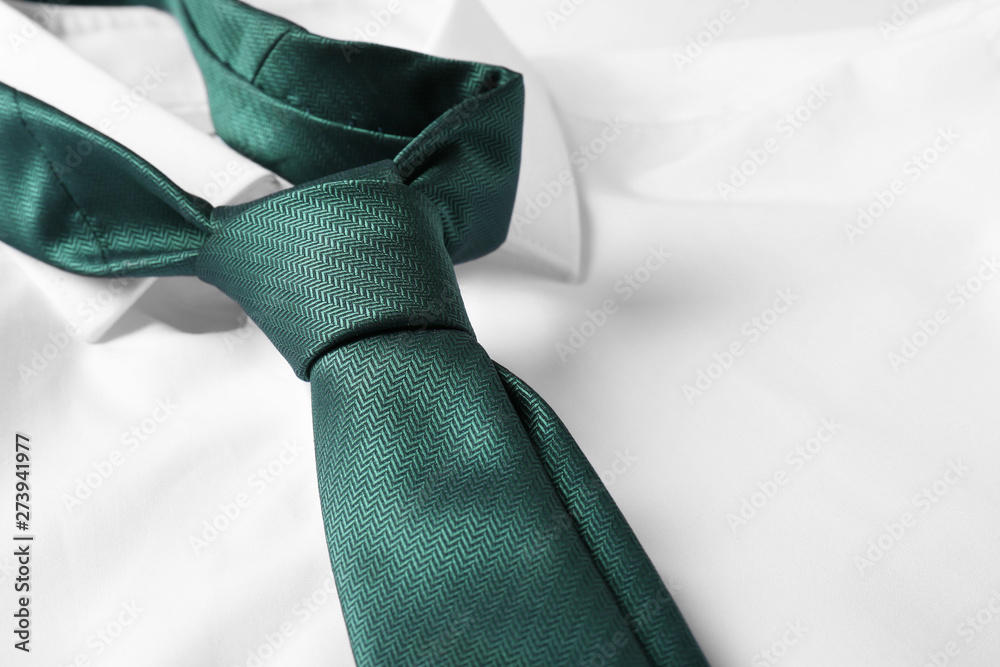 Color male necktie on white shirt, closeup - obrazy, fototapety, plakaty 