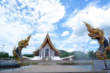 Two Naga statue,King of nagas Serpent animal in Buddhist legend and blue sky clouds in background at wat dhammayan,Thailand