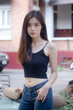 © tiniroma - Portrait of thai china adult beautiful girl black shirt blue jeans relax and smile
