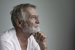 © FrameAngel - senior man thinking or try to remember alone closeup