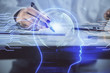 © peshkova - Multi exposure of woman's writing hand on background with brain hologram. Concept of brainstorming.