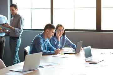 Wall Mural - Young people having business meeting in modern office