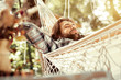 © Viacheslav Yakobchuk - Nice handsome man lying in the hammock