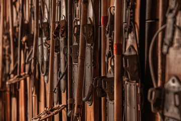 Collection of vintage old ski hanging on the wooden wall