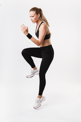 Sticker - Full length image of caucasian focused woman wearing running while working out