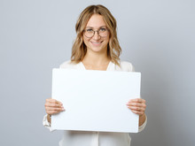 Pretty Young Woman Holding Empty Blank Board Isolated