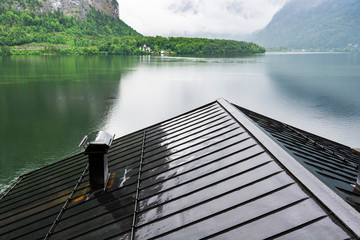 Sticker -  Austrian landscape with wet roofs.