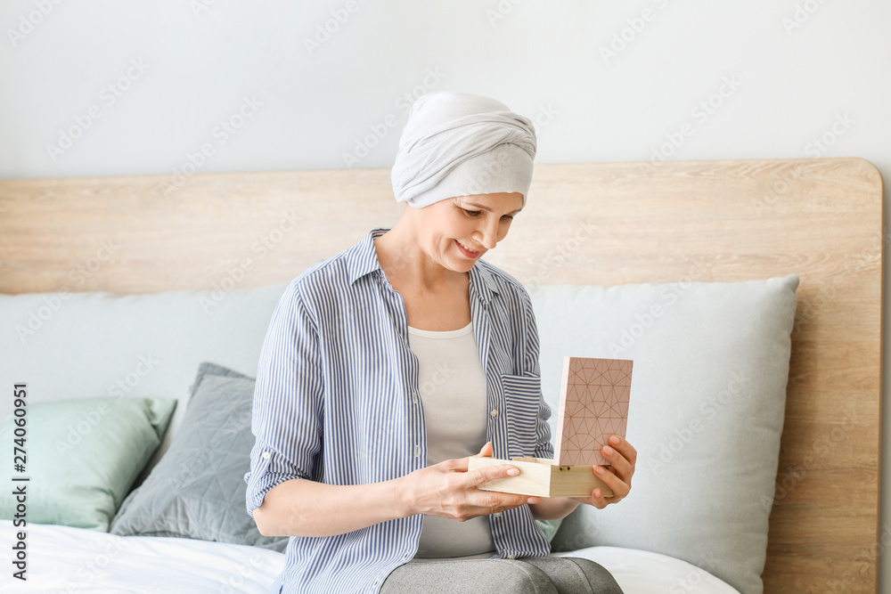 Mature woman after chemotherapy at home