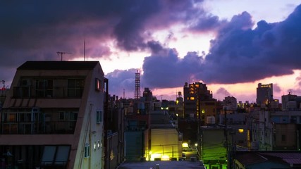 Sticker - Tokyo, Japan. Skyline in the morning, cloudy sky in the urban area in Asakusa, Tokyo, Japan. Time-lapse of the fast moving clouds with colorful sky at sunrise, panning video