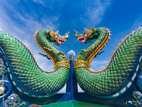 Naga or serpent statue with sunset in Wat khao phra kru temple, Chonburi province thailand, The belief of Buddhism, Thai temple Fototapeta