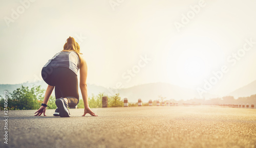 Fotografía Woman runner on the road shoes are prepared to leave the starting point
