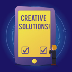 Fototapete - Text sign showing Creative Solutions. Conceptual photo mental process of creating unique solutions to problem Businessman Standing and Gesturing Facing Blank Screen Giant Tablet Device.