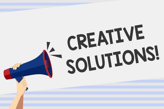 Writing note showing Creative Solutions. Business photo showcasing mental process of creating unique solutions to problem Human Hand Holding Megaphone with Sound Icon and Text Space.