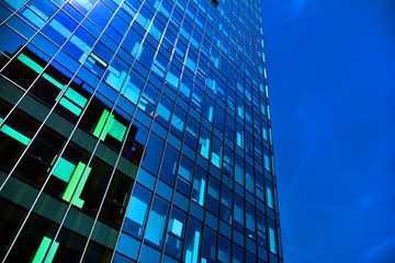 Black glass silhouette of skyscraper at night