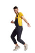 © nazarovsergey - Full-length portrait of a funny guy dancing in studio isolated on white background.
