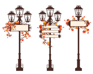 set of streetlights with blank information banners decorated with bright autumn maple branches - fall season in the city colorful vector design set