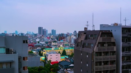 Wall Mural - Tokyo, Japan. Aerial view of skyscrapers in Shinjuku area in Tokyo, Japan. Sunrise with cloudy sky. Time-lapse in urban area with skyscrapers, panning video