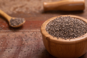 Wall Mural - Chia seeds in a wooden bowl