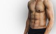 © Songsak C - Close Up of a muscular young man lifting weights on white background