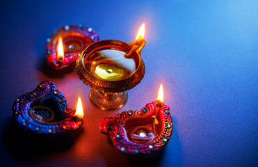 Wall Mural - Oil lamps lit during diwali celebration