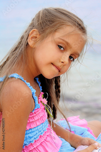 Cute Little Girl On The Beach Baby Is Resting Near The Sea Summer Holidays Girl In