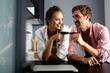 © NDABCREATIVITY - Young couple relaxing at home with laptop. Love,happiness,people and fun concept.