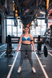 © Viacheslav Yakobchuk - Plump woman holding barbell standing in fitness center