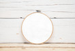 hoops for embroidery on a wooden background - a round layout for embroidery